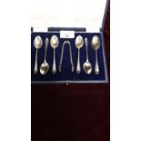 5 silver Hall marked sheffield spoons and matching tongs together with silver Hall marked spoon.