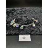 Heavy silver Charm bracelet set with enamel Charms all Marked silver.