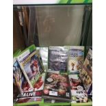 Shelf of xbox 360 games.