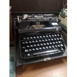 German olympia elite type writer with casing.