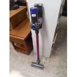 Dyson slim hoover with charger.