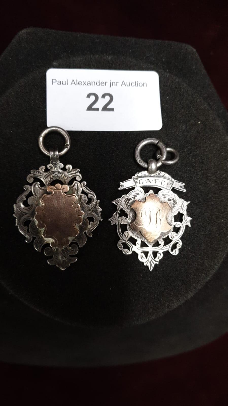 2 silver early 1900s fobs with gold Overlay