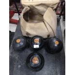 Set of vintage 1900s bowling bowls with bag.
