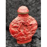 Oriental cinbar carved perfume bottle.