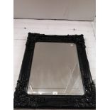 Large black framed mirror.