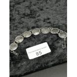 Silver coin bracelet dated 1933 upwards .