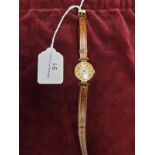 9ct 375 Hall Marked gold case wrist watch with leather strap in working order.