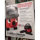 Boxed Henry hoover with accessories .