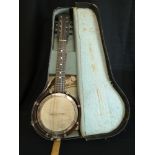 Quality banjo in fitted case.