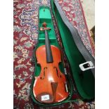 Violin with bow in fitted case.