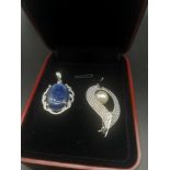 Silver pendant with blue stone together with sterling silver brooch set with pearl.
