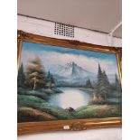 Large pil painting on canvis depicting Mountain and Loch scene in gilt frame.