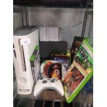 Xbox 360 console with power supply and games.