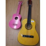 Herald guitar together with girls small pink guitar.