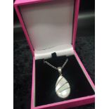 Heavy silver necklace with mother pearl style tear drop pendant.