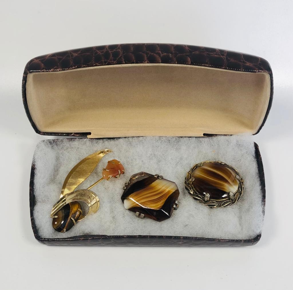 3 stunning vintage gold metal brooches that include 2 Tigers Eye art glass brooches.