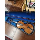 Antique violin with bow and case.