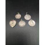 Lot of 5 silver St Christopher pendants.