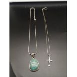Silver necklace with Ornate Turquoise pendant together with silver necklace with religious cross.