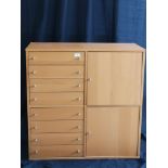 Lightwood 8 drawer chest with 2 doors.