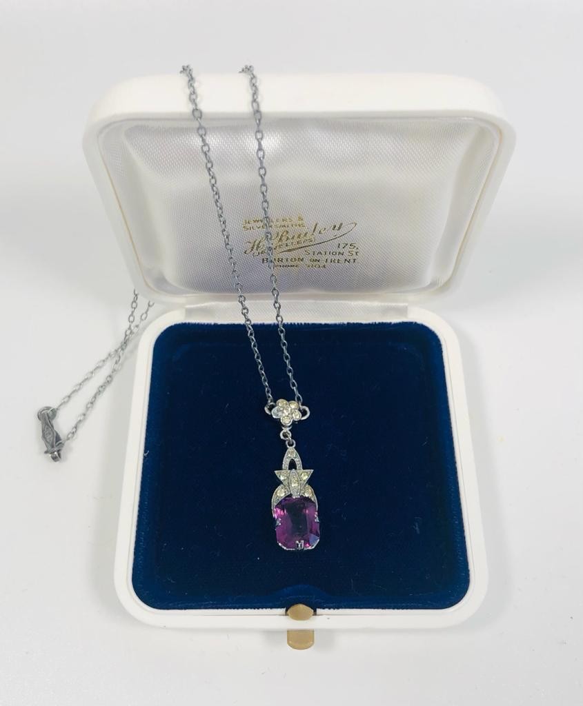 Amethyst set pendant silver colour necklace.