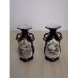 Pair of limoge style blue back ground vases depicting French style scene.