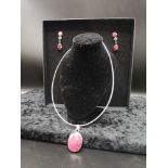 Silver stunning necklace set in the large Red stones with matching earrings.