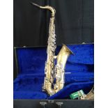 Large brass and mother of pearl saxophone in fitted case.
