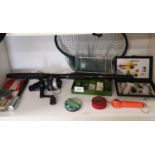 Shelf of fishing tackle, fly box with flies etc.