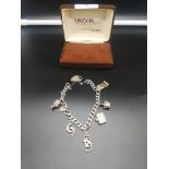 Very heavy silver charm bracelet with heavy charms includes rare queen's head charm etc.