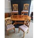 Pine Farm House style table with 4 pine chairs.