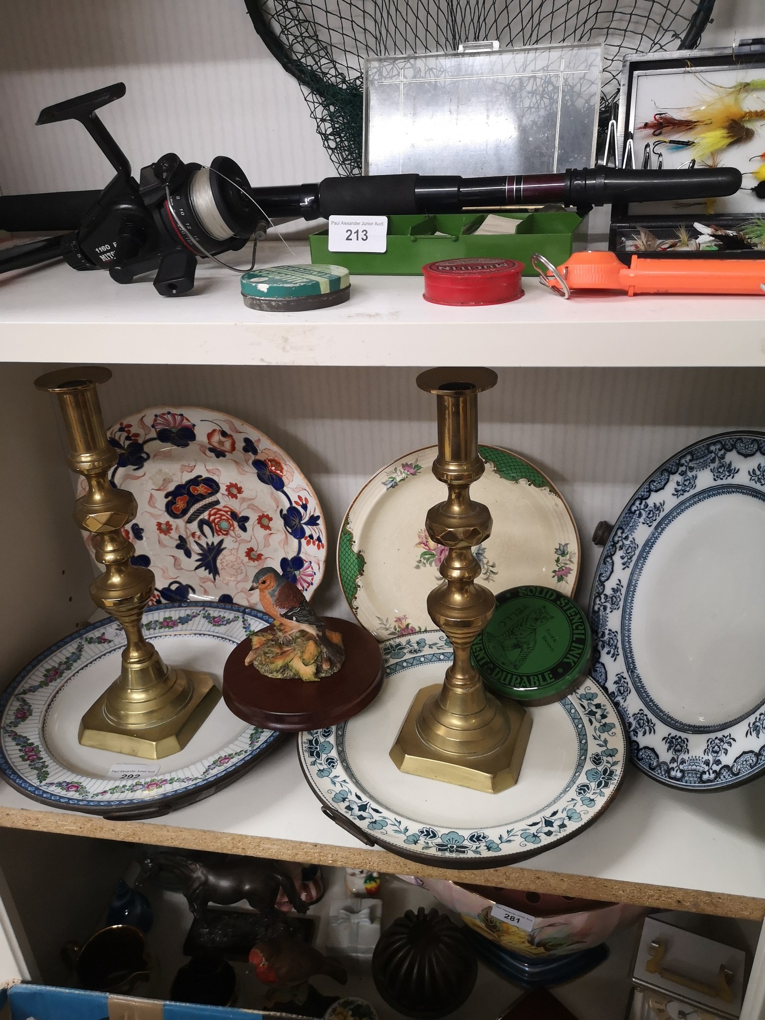 Shelf of collectables includes victorian draining bowls.