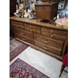 Large heavy oak style chest of drawers.
