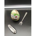 Ornate white metal fork together with cloisonné enamel egg together with stone pendant.