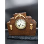 1900s art deco mantle clock with enamel face with clock and pendulum.