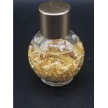 Small Bottle of 24kt gold leaf in bottle.