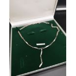 Silver necklace set with art deco mother of pearl design.
