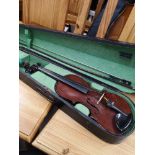 Antique violin with bow and case.