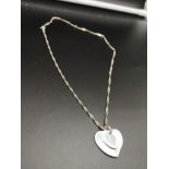 Silver ornate necklace with double heart pendant.