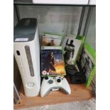 Xbox 360 console with power leads and games and controller.