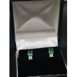 Pair of 18ct gold diamond and emerald earrings.