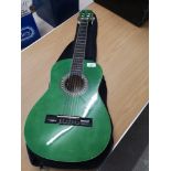 Green guitar with case.