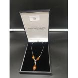 Silver Scottish arts and crafts necklace set with Amber stones.