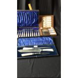 2 Boxed Fish knife and fork sets together with large carving set in fitted cases.