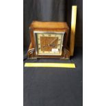 Art deco oak cased mantle clock with pendulum.