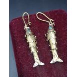 Heavy pair of 14k gold moveable carp fish earrings set with blue stones.