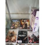 Shelf of PlayStation 3 games etc.