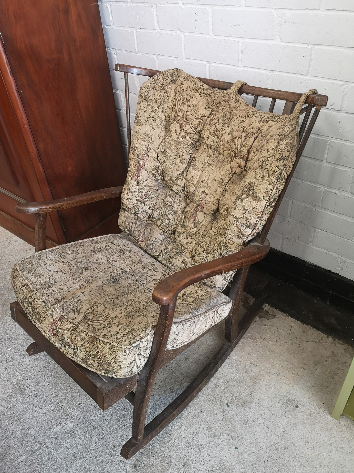 19th century rocking chair with original upholstery.