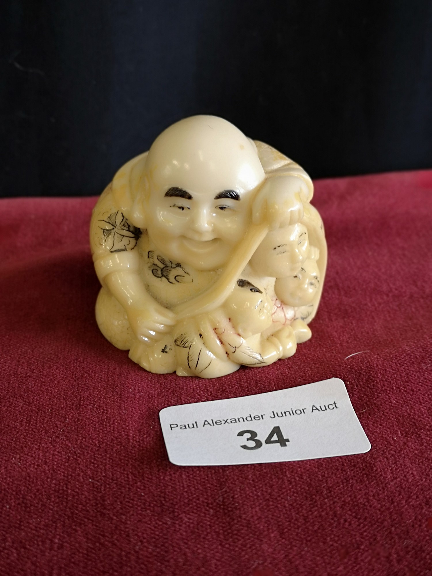 Oriental monk Netsuke signed to base.