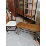 Vintage liar shaped end table with brass feet together with vintage chair.